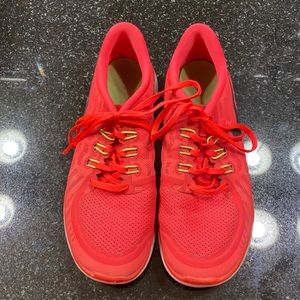 Size 7 youth, Nike, neon red orange, used tennis shoes.